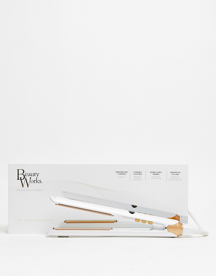 White and gold Beauty Works straightener with ceramic plates, featuring temperature control buttons, displayed alongside its sleek packaging.