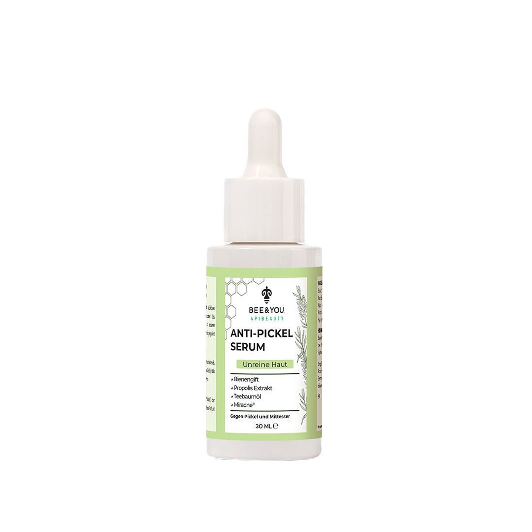 White bottle with a dropper, featuring a green label with text in German, highlighting "Anti-Pickel Serum" and ingredients like Propolis and Tea Tree Oil, 30 mL size.