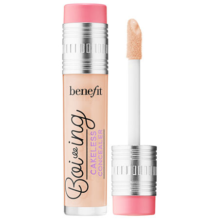 Benefit Boi-ing Cakeless Concealer in a clear tube with a silver cap, featuring a soft applicator wand and a light beige shade, labeled with purple and pink accents.