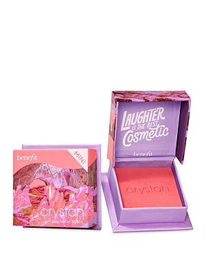 Benefit Crystah Mini Blush in Strawberry Pink features a vibrant pink powder in a compact with a purple interior, adorned with a whimsical design and the text "Laughter is the Best Cosmetic."