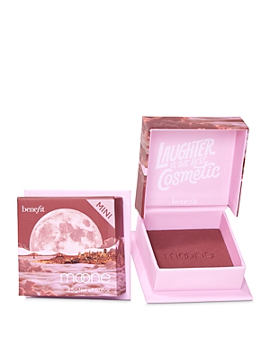 Rich berry blush in a compact with a pink exterior, featuring a scenic moonlit landscape on the cover and the text "Laughter is the best cosmetic" inside.