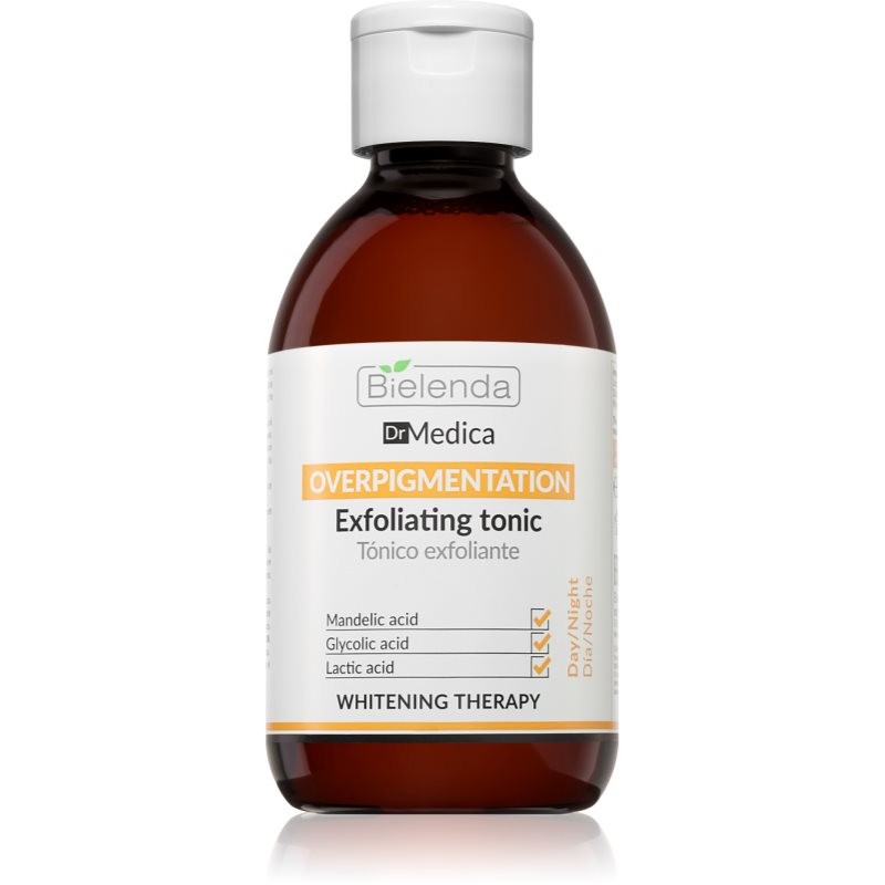 Brown glass bottle with a white label, featuring the Bielenda logo and product name "Overpigmentation Exfoliating Tonic," highlighting key ingredients like mandelic acid and glycolic acid.