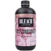 Black bottle with a matte finish, featuring a pink label that reads "BLEACH LONDON ROSE CONDITIONER" in bold black text, with a floral background design.