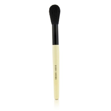 Black bristles with a tapered shape on a cream-colored handle featuring the Bobbi Brown logo, designed for applying sheer powder.