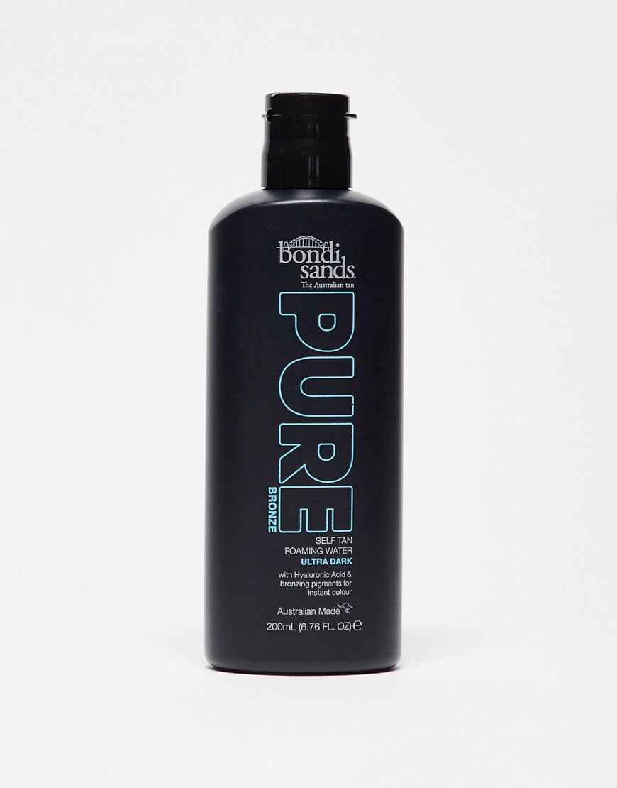 Black bottle with a sleek design, featuring turquoise text that reads "PURE" and "Self Tan Foaming Water Ultra Dark," 200ml size, with a black cap.