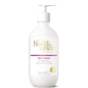White bottle of Bondi Sands Tropical Rum Body Wash, 500ml, featuring a pump dispenser and gold and pink accents on the label.