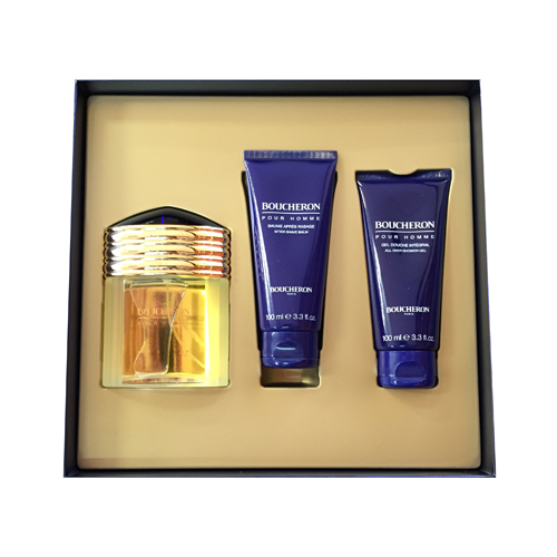 Gift set featuring a gold and glass fragrance bottle, accompanied by two blue tubes labeled "Boucheron Pour Homme" for aftershave balm and shower gel, all in a stylish black box.