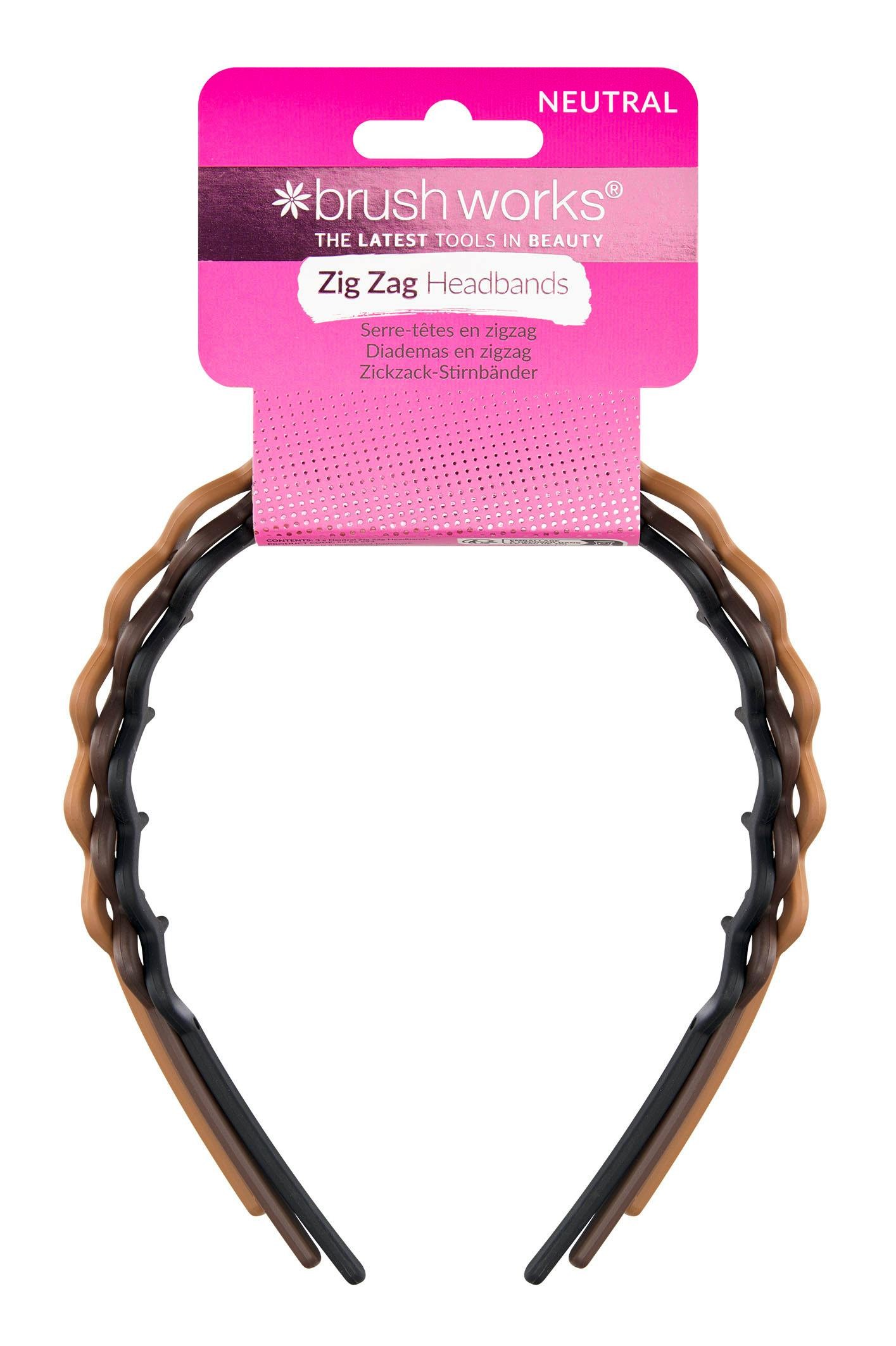 Three zigzag headbands in neutral tones of brown and black, featuring a glossy finish, packaged with a pink header label from Brushworks.