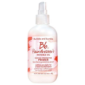 Clear plastic bottle with a white spray nozzle, featuring a pink and white label that reads "Bb. Hairdresser's Invisible Oil Heat/UV Protective Primer" in bold text.