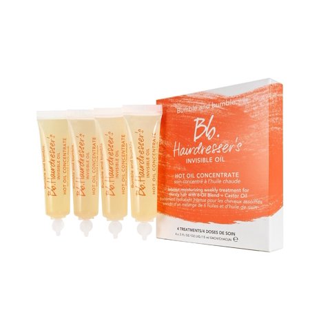 Four small tubes of Bumble and Bumble Bb. Hairdresser's Invisible Oil Hot Oil Concentrate in a box, featuring a warm orange design and white text on a light background.