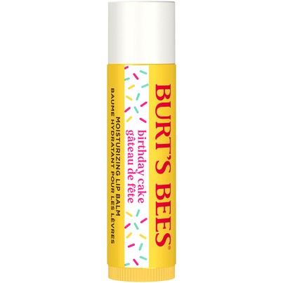 Yellow tube of Burt's Bees 100% Natural Origin Moisturizing Lip Balm labeled "Birthday Cake," featuring colorful sprinkles and a white cap.