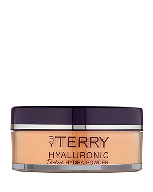 Transparent container with a purple lid, featuring "BY TERRY HYALURONIC TINTED HYDRA-POWDER" label, showcasing a light beige powder inside.