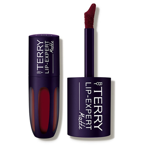 Deep burgundy liquid lipstick in a sleek, dark purple tube with a glossy finish, featuring a precise applicator for smooth application.