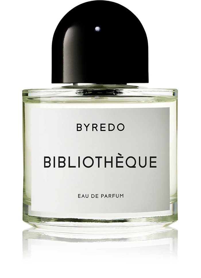 Clear glass bottle of Byredo Bibliothèque Eau De Parfum, featuring a sleek black cap and minimalist white label with bold black text, exuding a sophisticated masculine fragrance.