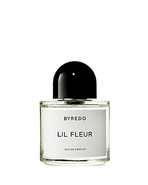 Clear glass bottle with a minimalist design, featuring a black cap and a white label that reads "BYREDO LIL FLEUR" in bold text, containing 3.4 fl. oz of Eau De Parfum.