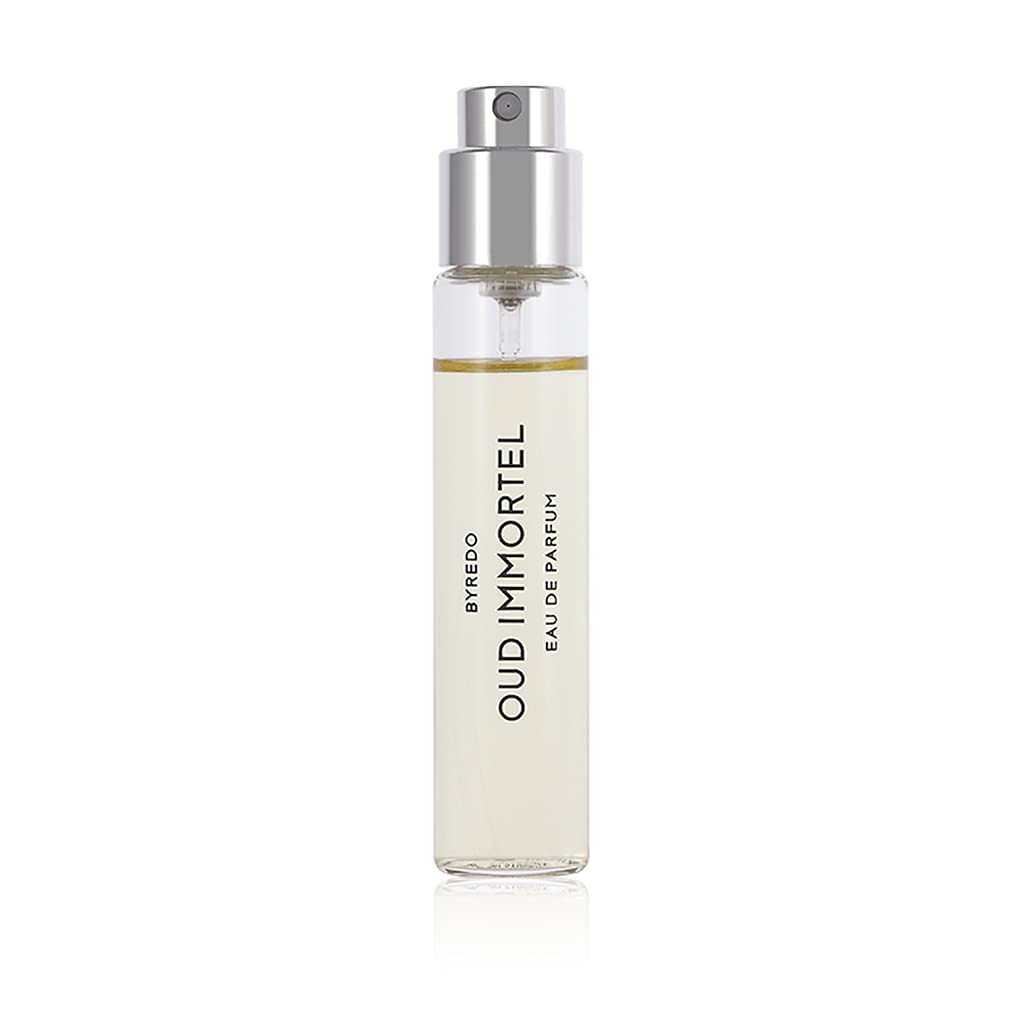 Clear glass spray bottle with a silver cap, containing a light amber liquid labeled "BYREDO OUD IMMORTEL EAU DE PARFUM" in bold black text, designed for unisex use.