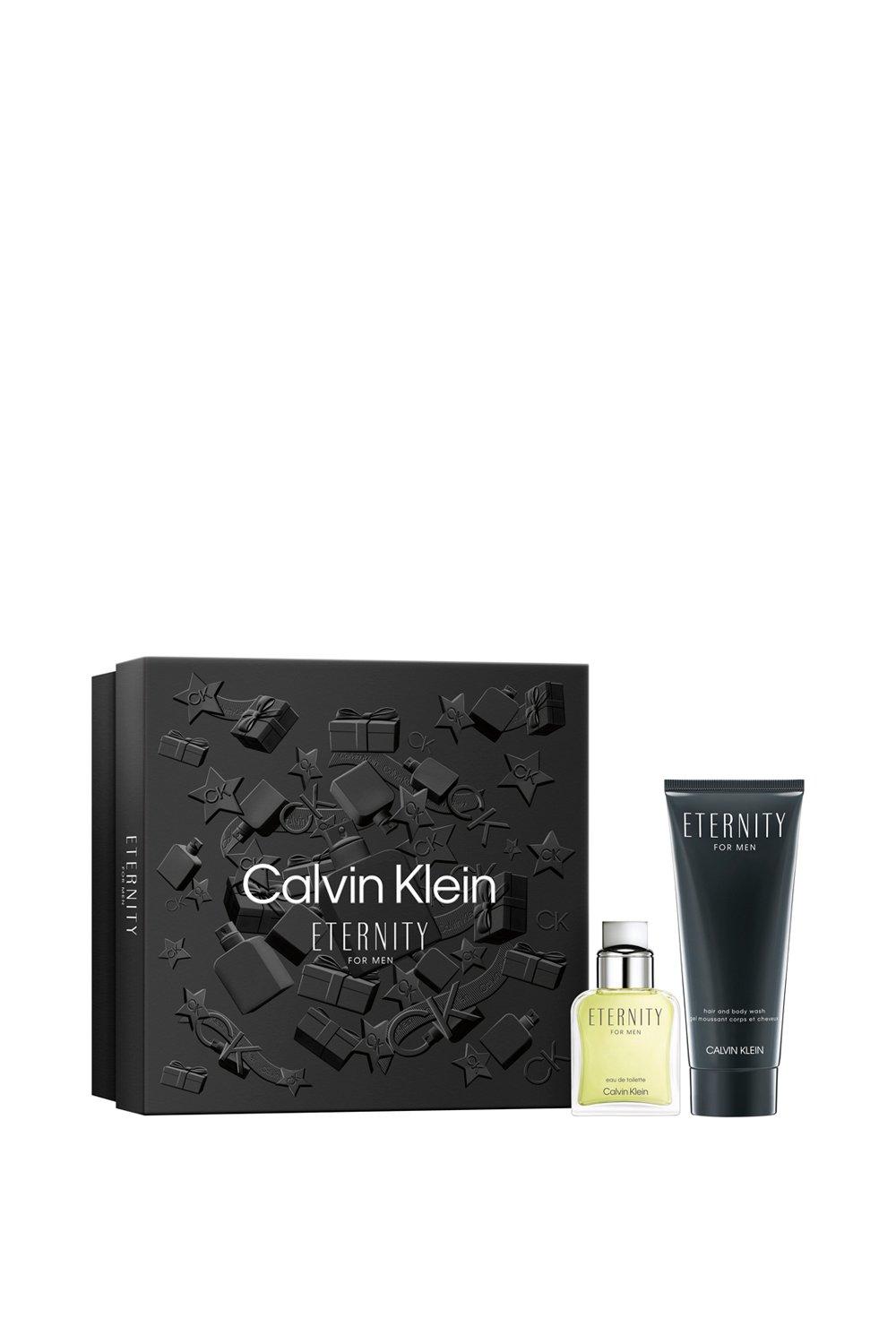 Calvin Klein Eternity for Men gift set featuring a green-tinted fragrance bottle and a black tube of body wash, presented in a textured black box with embossed designs.