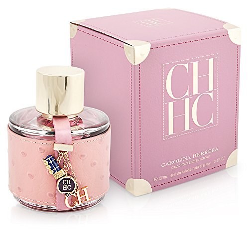 Carolina Herrera CH Grand Tour Eau De Toilette features a round glass bottle with a pink textured leather base, gold cap, and charm, accompanied by a matching pink box.