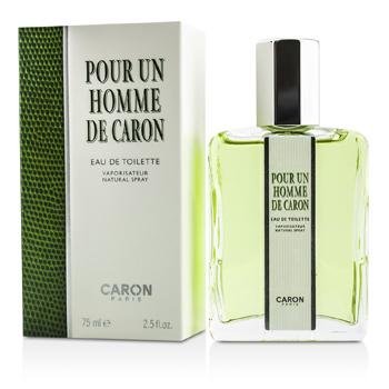 Clear glass bottle with a green liquid, featuring a black cap and a rectangular label reading "Pour Un Homme De Caron," alongside a textured green box.