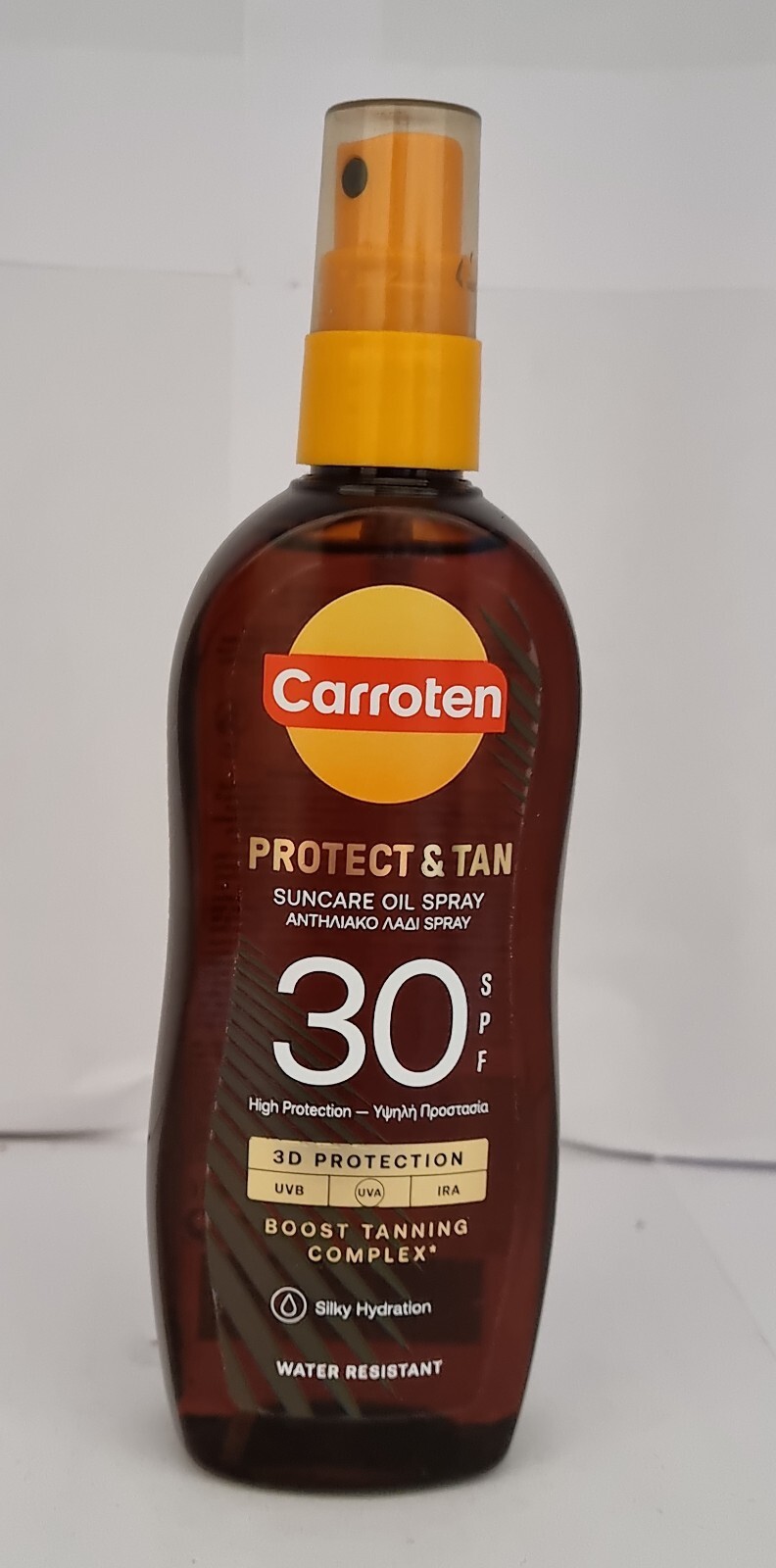 Carroten Intensive Tanning Oil SPF 30 in a brown plastic bottle with an orange spray nozzle, featuring bold text and a sun protection label, highlighting hydration and UV protection.