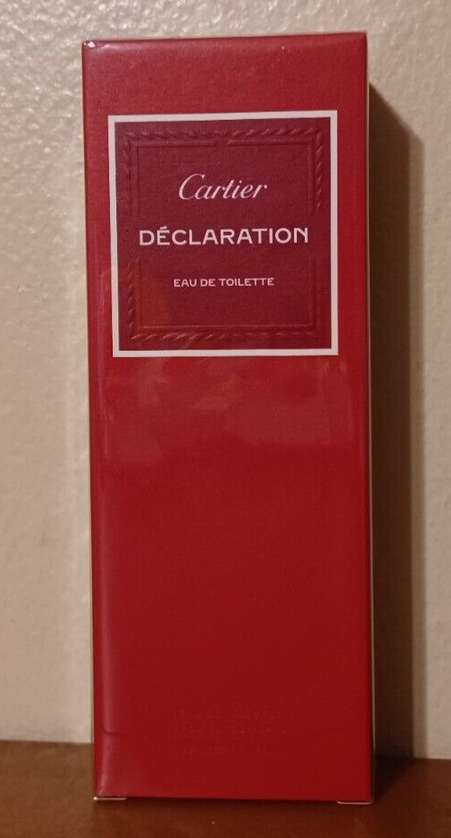 Red rectangular box featuring the Cartier logo and the word "DÉCLARATION" prominently displayed, labeled as Eau De Toilette, with a sleek, glossy finish.