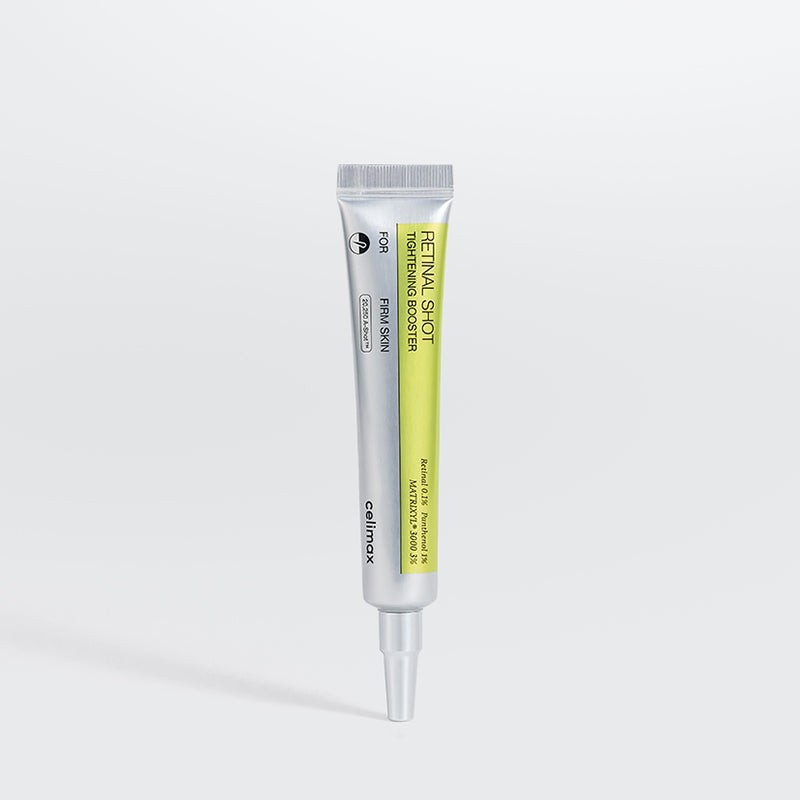 Celimax Retinal Shot Tightening Booster in a sleek silver and green tube with a pointed applicator, labeled with product details, 0.5 Fl Oz (15 Ml).