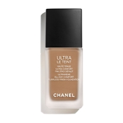Beige foundation in a sleek glass bottle with a black cap, labeled "CHANEL ULTRA LE TEINT FLUIDE" and features "Ultrawear" and "All-Day Comfort" text.
