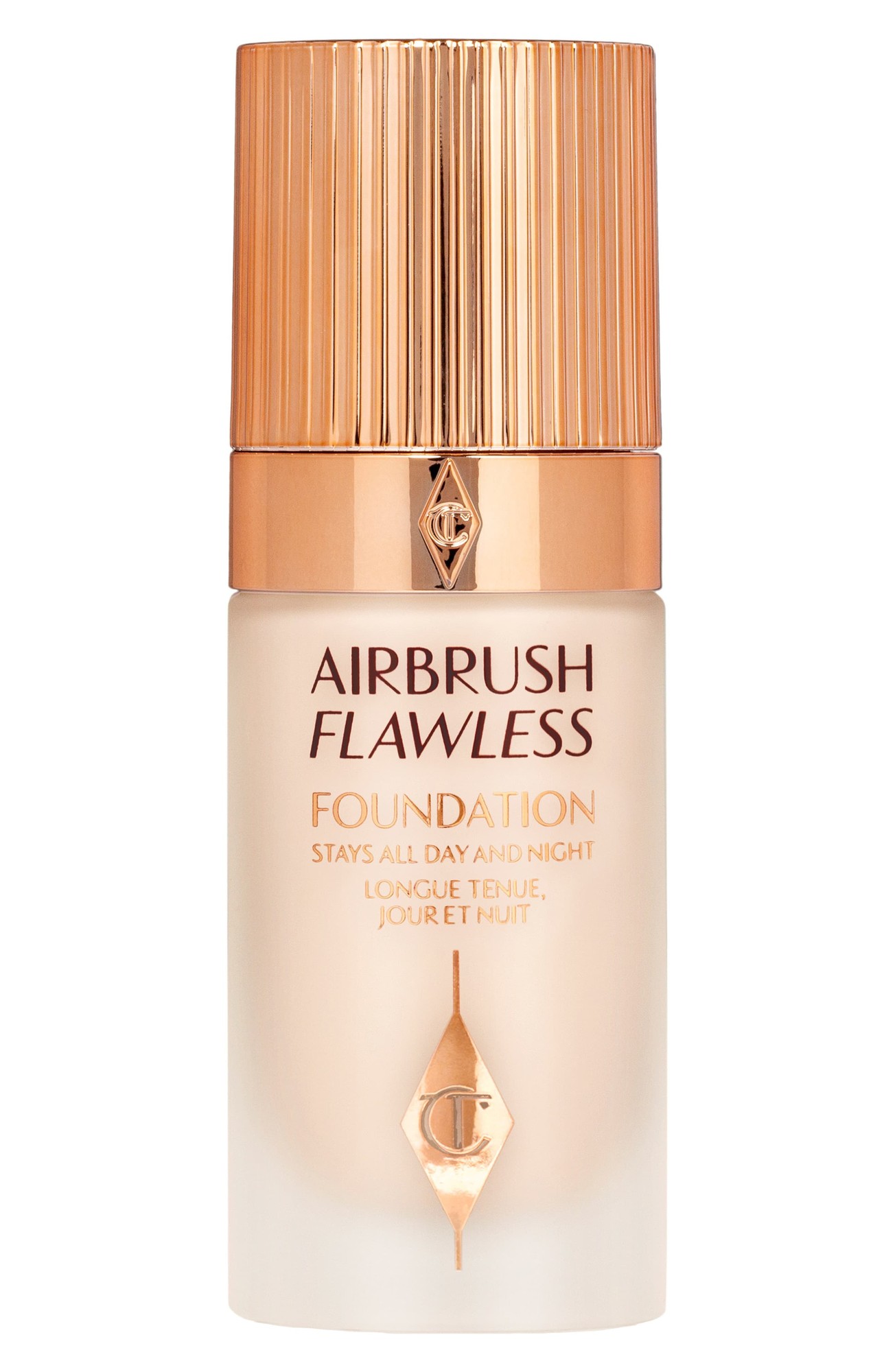 Charlotte Tilbury Airbrush Flawless Foundation in a sleek glass bottle with a gold ribbed cap, featuring elegant branding and a light, cool-toned liquid inside.