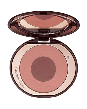 Charlotte Tilbury Cheek to Chic Blusher in "Sex on Fire," featuring a dual-tone blush compact with a soft pink outer ring and a deep plum center, encased in a sleek, reflective packaging.