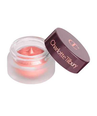 Charlotte Tilbury Hypnotising Pop Shot in Smokey Quartz features a frosted glass jar with a deep burgundy lid, showcasing a shimmering champagne eyeshadow inside.