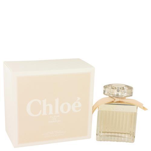 Chloé Fleur De Parfum Eau De Parfum 75ml features a clear glass bottle with vertical ridges, a round cap, and a soft pink ribbon, presented in a cream-colored box with elegant branding.