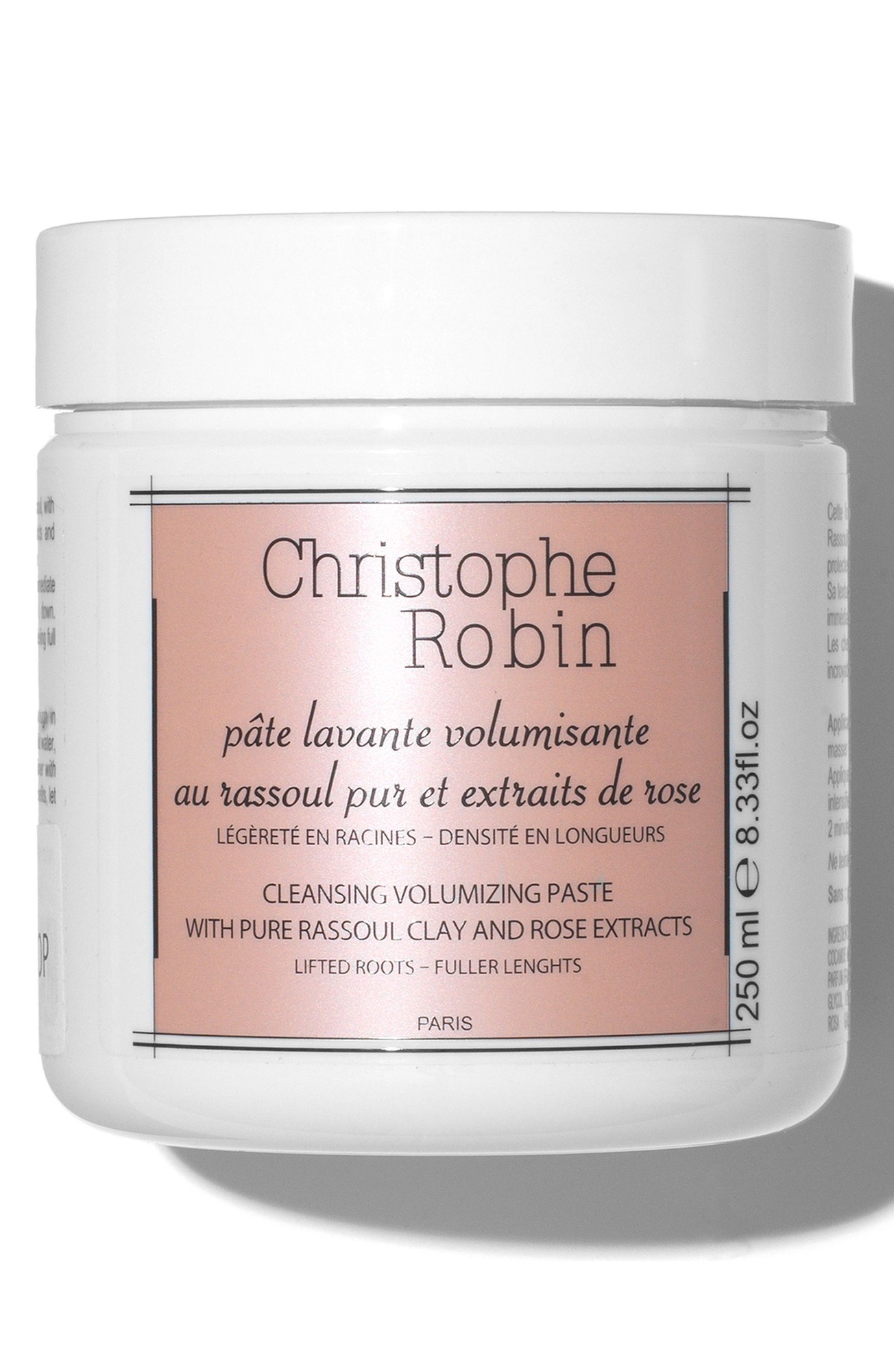 White jar with a pink label, featuring the text "Christophe Robin Cleansing Volumising Paste" and details about pure Rassoul clay and rose extracts, 250ml size.