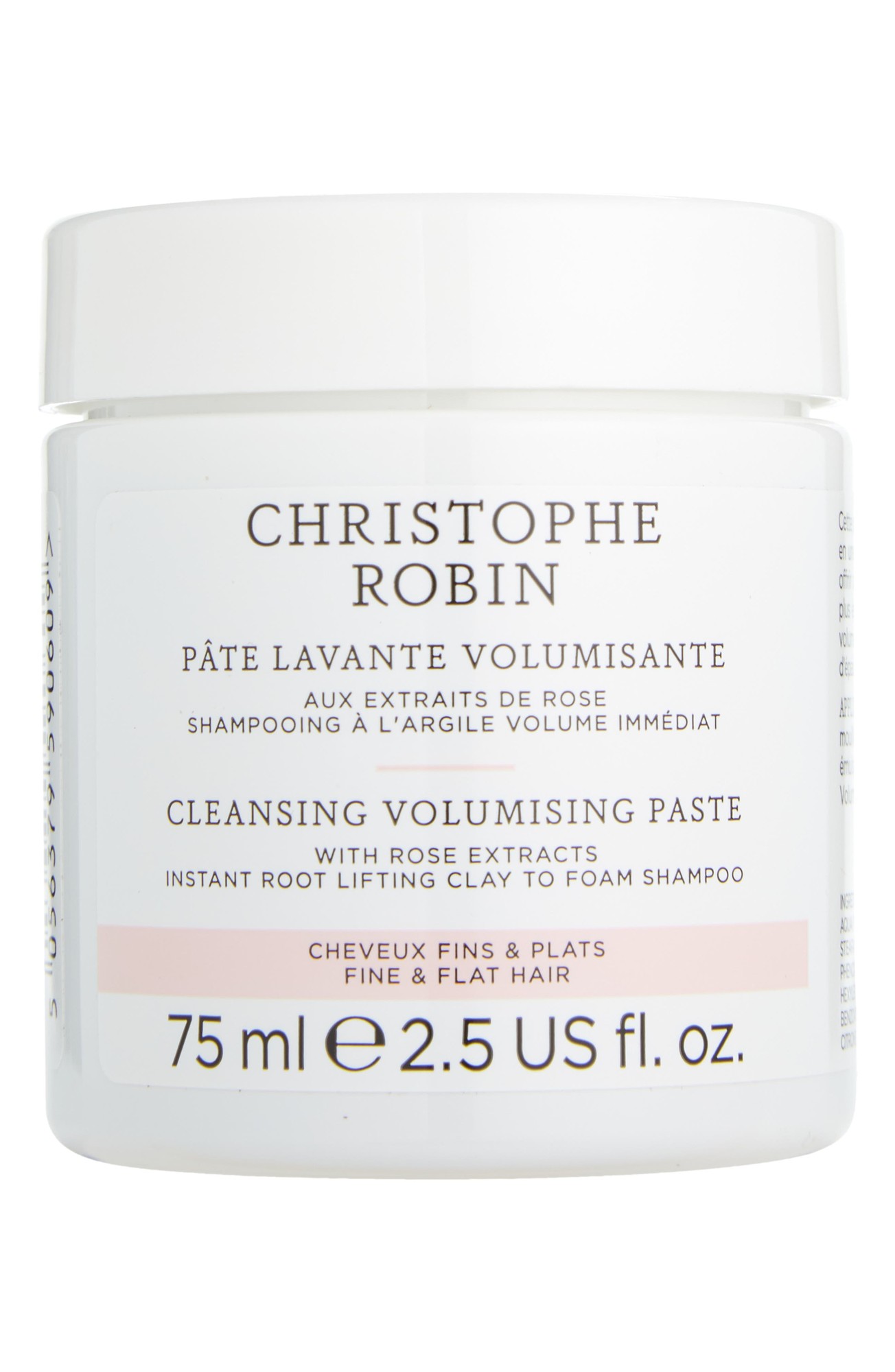 White jar with a clear lid, labeled "Christophe Robin Cleansing Volumizing Paste," featuring pink accents and text, containing 75 ml of product with pure rassoul clay and rose extracts.