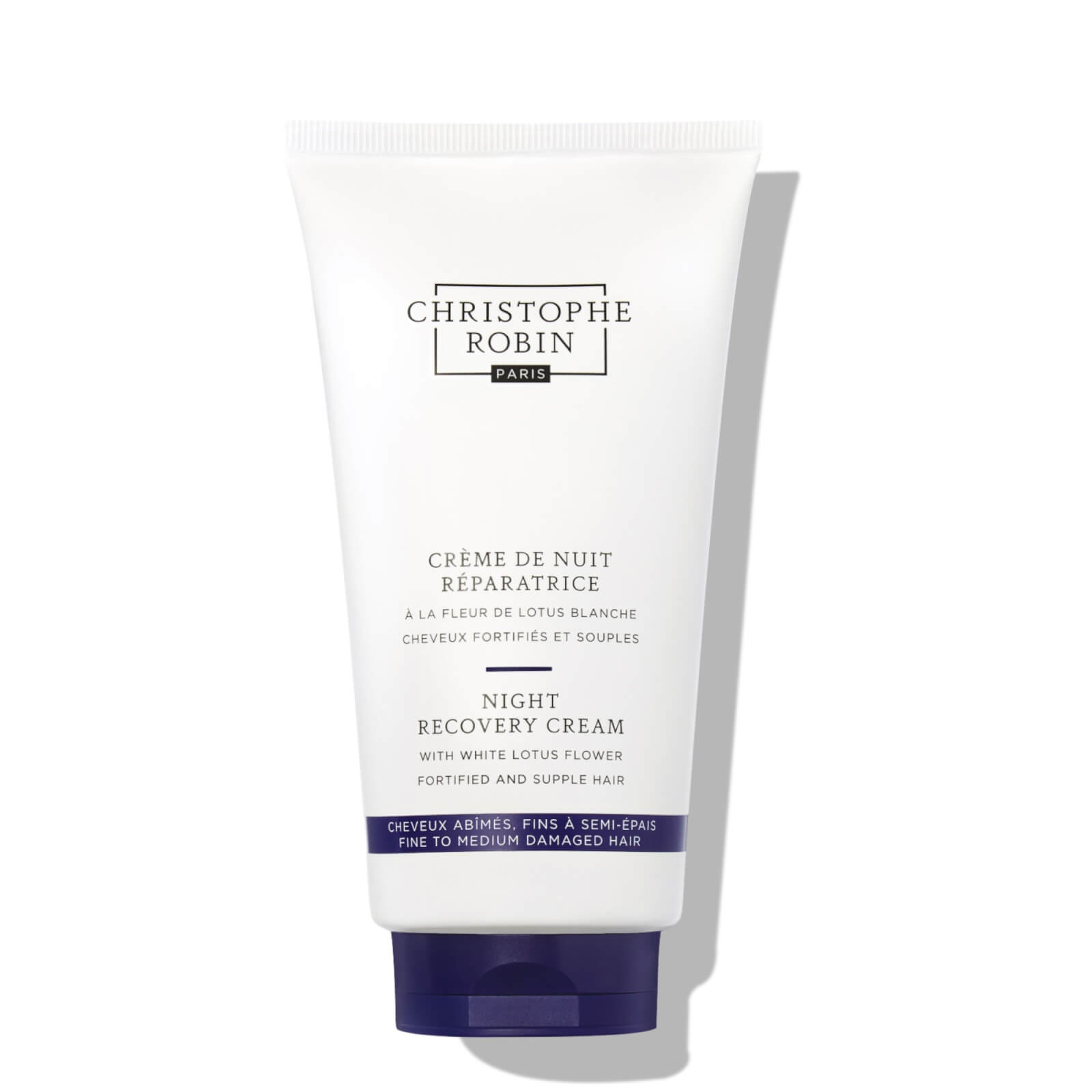 White tube of Christophe Robin Night Recovery Cream with a purple cap, featuring a minimalist design and text in black, highlighting its key ingredient: white lotus flower.
