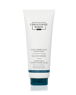 White tube with a turquoise label featuring "Christophe Robin" and "Purifying Duo," showcasing a sleek design and a flip-top cap, ideal for hair care.