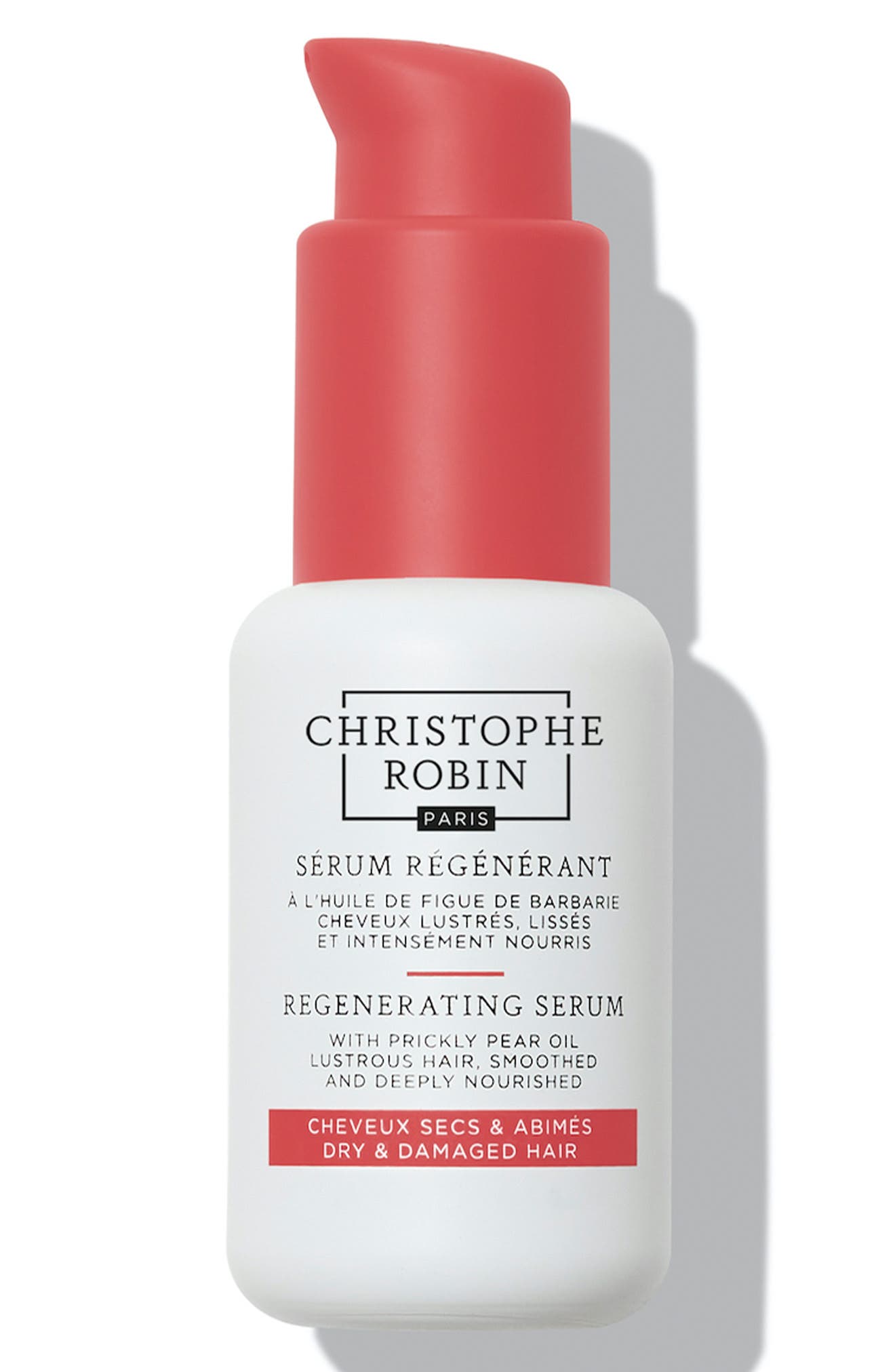 White bottle with a pink pump top, featuring black and red text, labeled "Christophe Robin Regenerating Serum with Prickly Pear Oil 50ml" for dry and damaged hair.