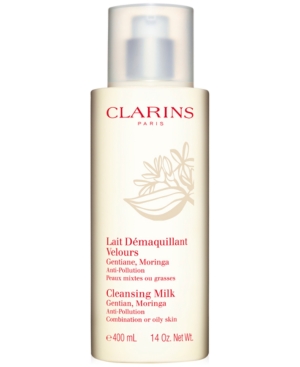 Clarins Cleansing Milk in a 400ml white bottle with a pump dispenser, featuring a floral design and labeled for combination or oily skin, emphasizing anti-pollution benefits.