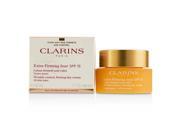 Extra-Firming Jour Wrinkle Control cream in a gold and white jar with a gold lid, accompanied by a matching box, labeled for all skin types and SPF 15 protection.