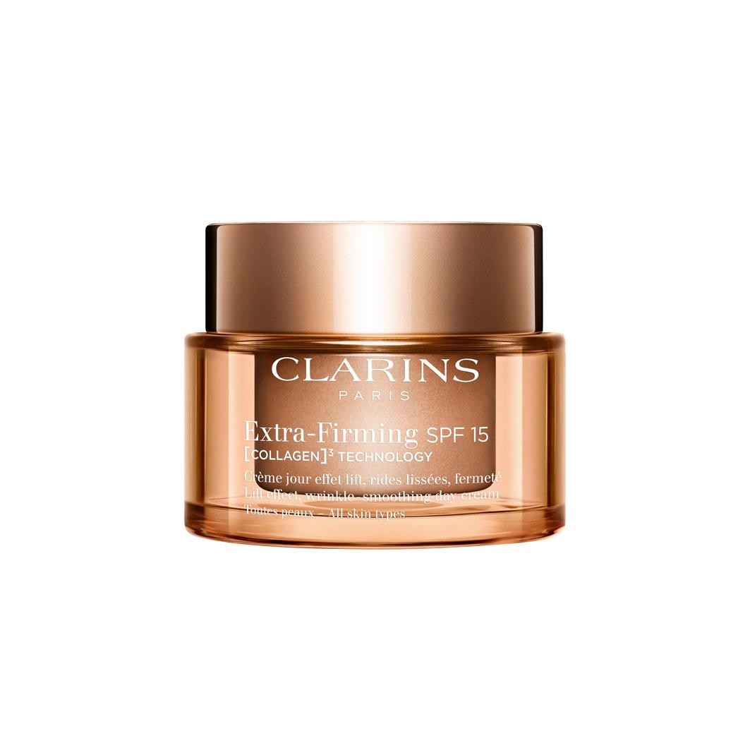 Clarins Extra Firming SPF 15 Day Cream in a gold and clear jar, featuring a smooth finish and a gold lid, labeled with product details and a 50ml capacity.