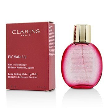 Clarins Fix' Make Up in a pink glass bottle with a gold cap, alongside a red box featuring white text, labeled as a long-lasting makeup hold spray, 50ml/1.7oz.