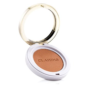 Round compact featuring a golden rim and white base, containing a soft, warm brown blush labeled "CLARINS" in the center, ideal for adding a natural flush to cheeks.
