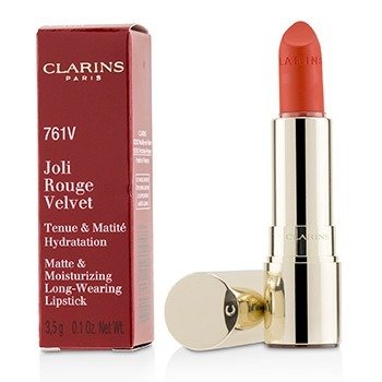 Clarins Joli Rouge Velvet 761V Spicy Chili Lipstick in a sleek gold tube, featuring a rich, warm red shade, alongside a red and gold box with product details.