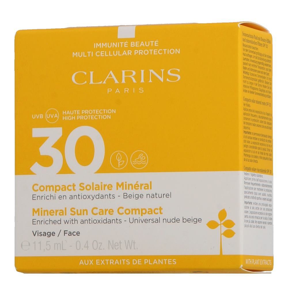 Compact mineral sunscreen in a yellow box with white text, featuring "Clarins" branding, SPF 30, and indicating it's for face use, with a net weight of 15g.