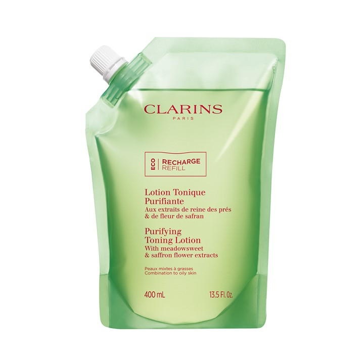 Green, eco-friendly refill pouch for Clarins Purifying Toning Lotion, 400 ml, featuring a spout for easy pouring and labeled with floral extracts and benefits for oily skin.