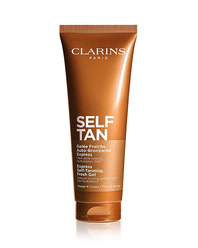Clarins Self-Tan Gel in a 4.5 oz brown tube with a gold cap, featuring white text that reads "SELF TAN" and "Gélée Fraîche Auto-Bronzante" prominently displayed.
