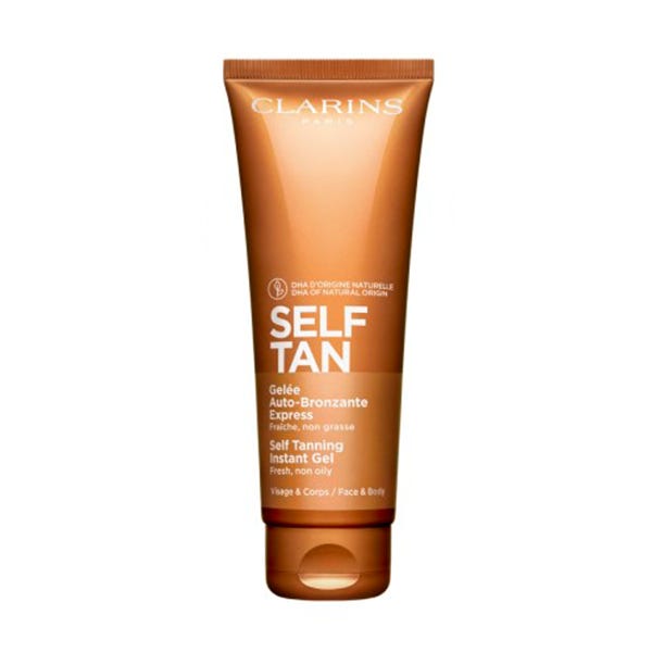 Clarins Self Tanning Instant Gel in a 125 ml brown tube with a flip-top lid, featuring a gold label with white text, designed for a fresh, non-greasy tan.