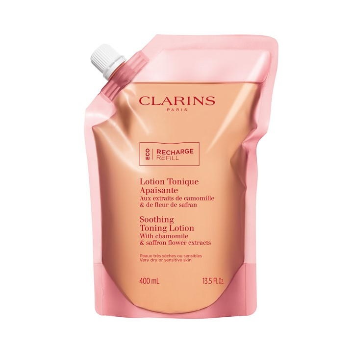 Clarins Soothing Toning Lotion refill pouch in pink and orange, featuring a spout for easy pouring, labeled with product details and eco-friendly "Recharge" indication.