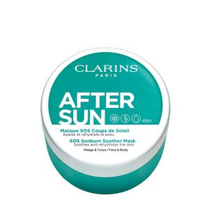 Round turquoise container with a white lid, labeled "Clarins After Sun SOS Sunburn Soother Mask," designed for face and body, 100ml size, featuring soothing and hydrating claims.