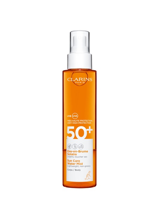 Clarins Light Tanning Spray SPF 50+ in a transparent orange bottle with a white spray nozzle, featuring bold white text and a sun icon, designed for body use.