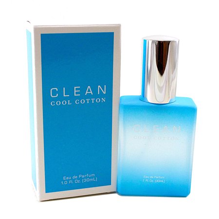 Light blue glass bottle with a silver cap, labeled "CLEAN COOL COTTON," beside a matching blue and white box, both featuring a fresh, minimalist design.